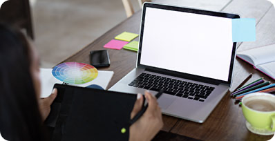 A group of professionals giving a fist bump over a table.