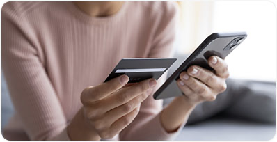 People walking through a large, modern conference hall.