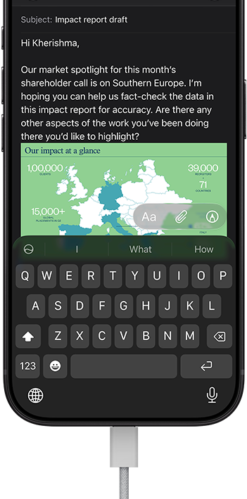 iPhone 18 Pro, black, connected to a charger, screen shows a work email in Mail