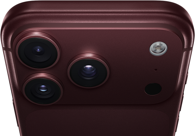 iPhone 18 Pro Max, burgundy color (dark red), back exterior, Pro Fusion camera system at top, 3 lenses, variable aperture blades partially closed, flash, microphone and LiDAR Scanner, top exterior, cellular antenna, flat sides, rounded edges